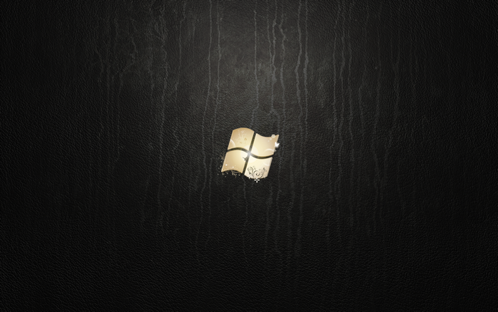 Windows 7 logo on a black textured background