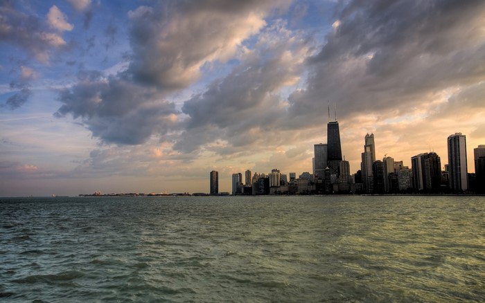 Chicago skyline at sunset over Lake Michigan