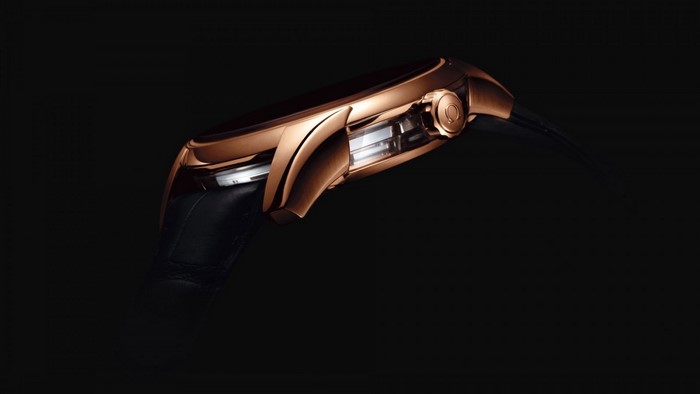 Omega rose gold watch with black strap