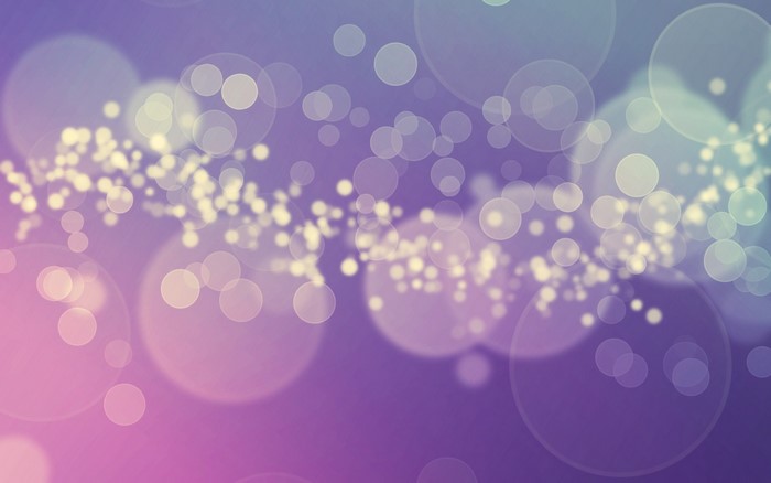 Abstract bokeh lights on purple and pink gradient background