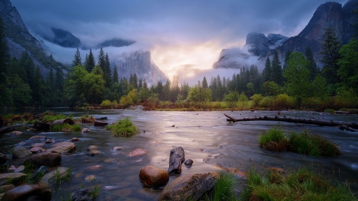 Sunlit Yosemite Valley River at Morning Mist