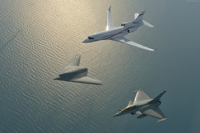 Dassault nEUROn, Rafale, and Falcon 7X flying over water