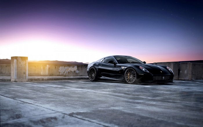 Black Ferrari 599 GTB Fiorano on rooftop parking lot