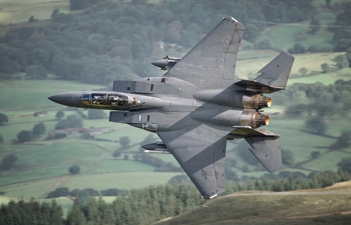 McDonnell Douglas F-15E Strike Eagle in flight over countryside