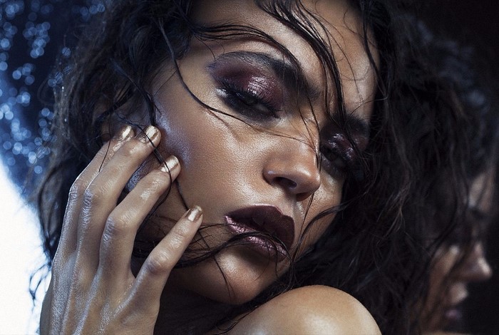 Woman with dramatic makeup and wet hair