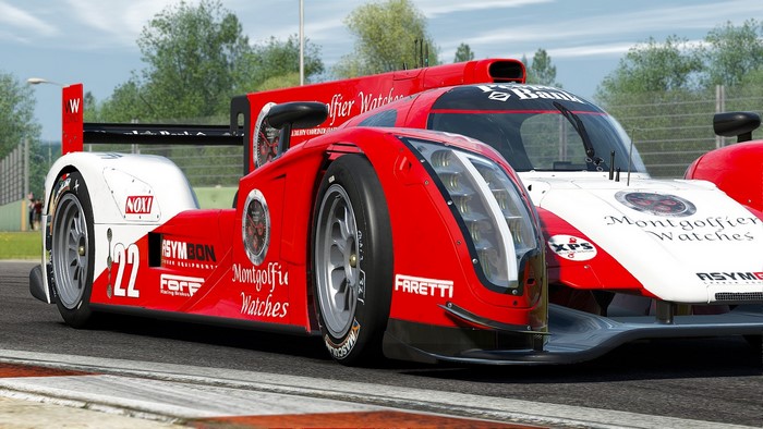 Red and white racing car with number 22 on a track