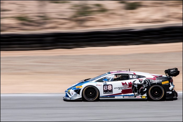 Lamborghini race car with number 88 on a race track