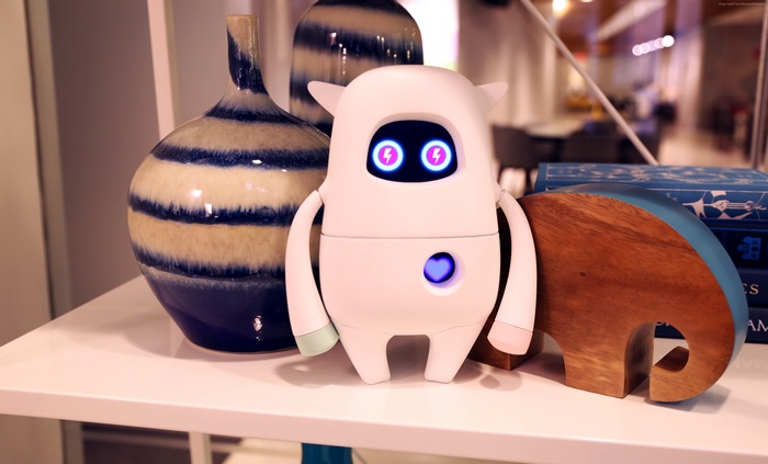 Musio robot with decorative vases and elephant bookend