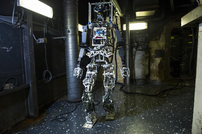 Saffir robot in a dark industrial setting