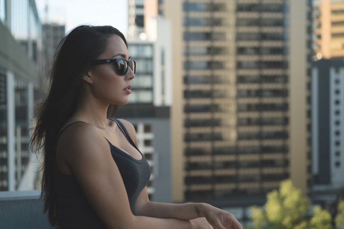 Woman wearing sunglasses looking away from camera