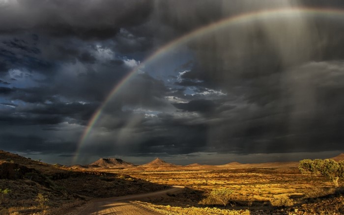 Rainbow over a desert landscape in Namibia