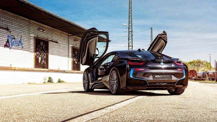 Black BMW i8 with butterfly doors open