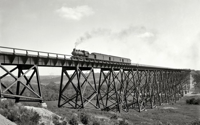 Steam locomotive on a truss bridge