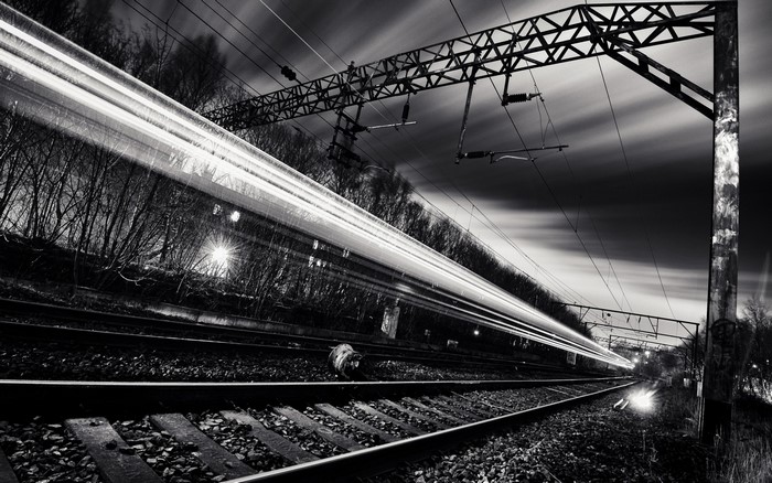 Long exposure of a train on railway tracks at night