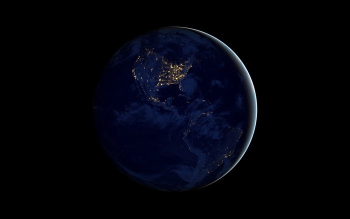 Earth at night from space showing North and South America