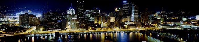 Pittsburgh skyline at night with river reflections