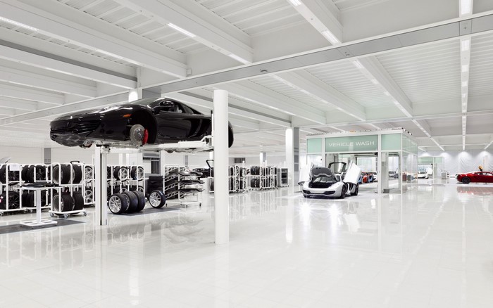 McLaren Technology Centre interior with cars and tires