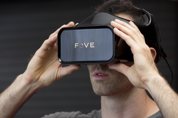 Man wearing a black Fove VR headset