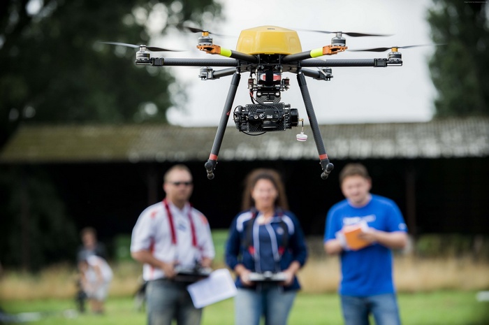 Trimble ZX5 multicopter drone flying with people below