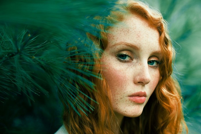Close up portrait of a redhead woman with freckles