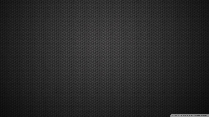 Black textured surface with gradient lighting
