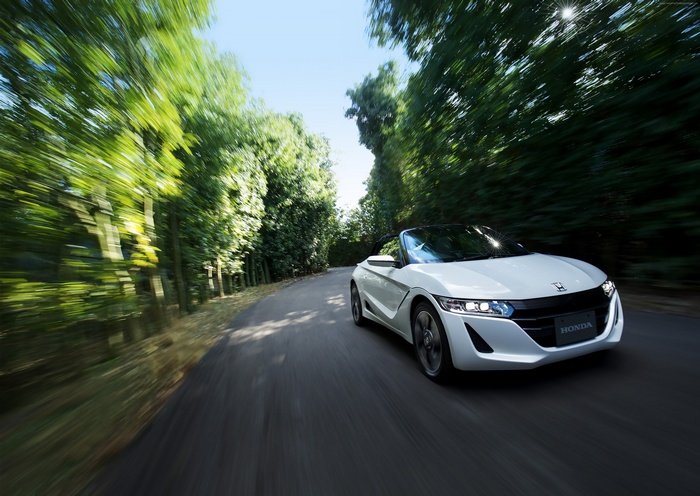 White Honda S660 Convertible Driving on a Tree-Lined Road