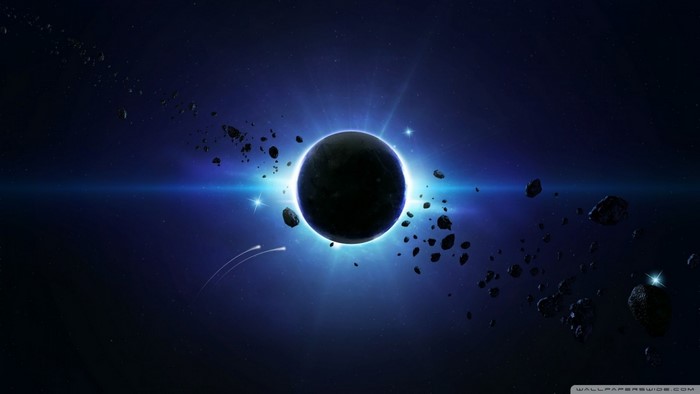 Planet in space with asteroids and bright light