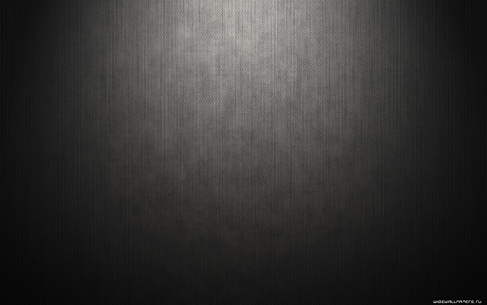 Dark textured surface with light gradient