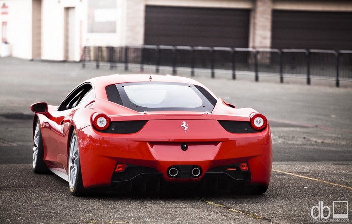 Red Ferrari 458 Italia parked on asphalt