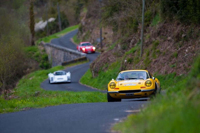 Yellow sports car on a winding road