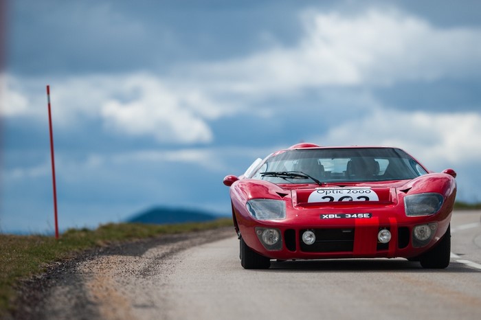 Red Ford GT40 race car on a road