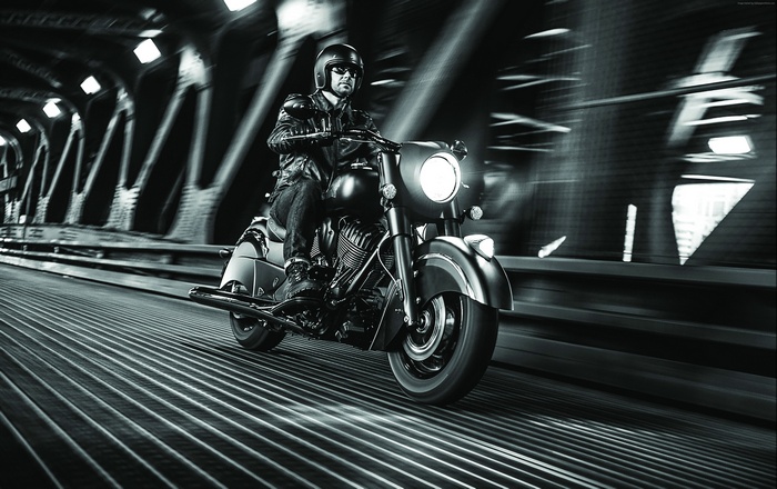 Man riding an Indian Chief Dark Horse motorcycle
