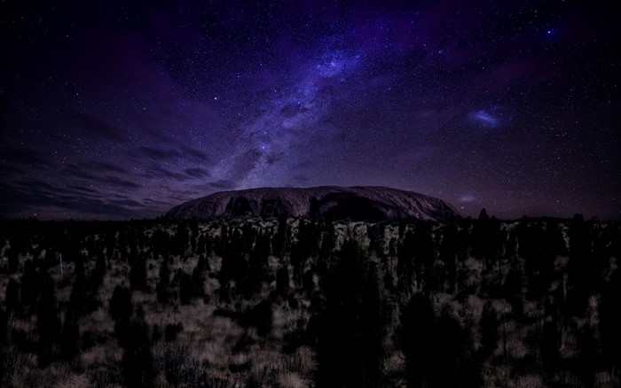 Uluru under the Milky Way at night