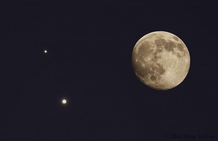 Moon and Jupiter with moons in the night sky