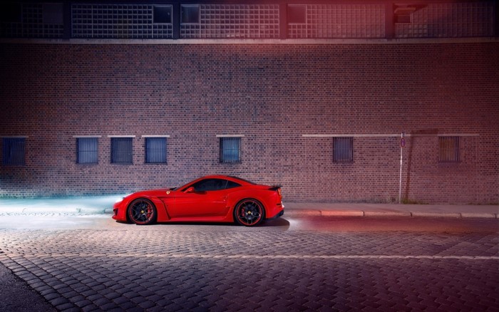 Red Ferrari California T Novitec N Largo parked by brick wall