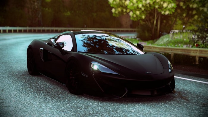 Black McLaren MP4-12C sports car on a road