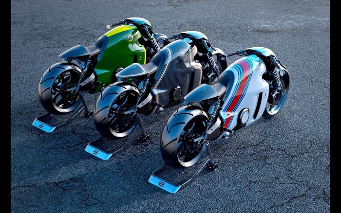 Three Lotus motorcycles on a race track