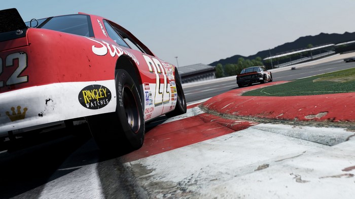 Red and white race car on a track