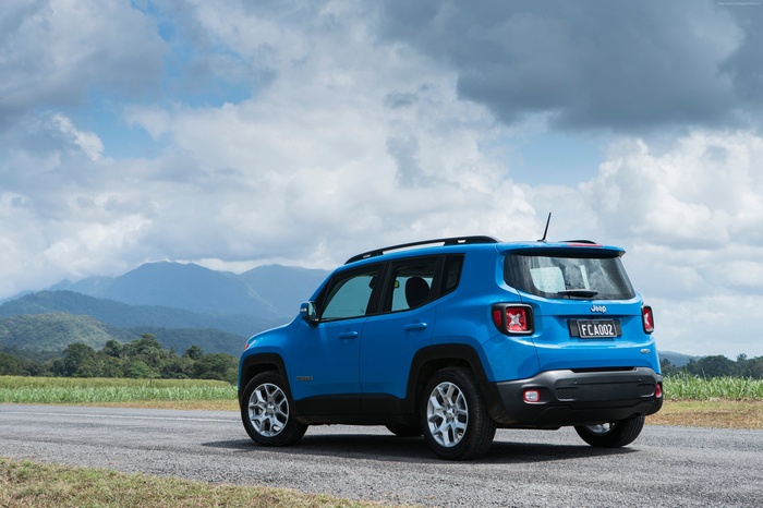 Blue Jeep Renegade Longitude SUV on a road