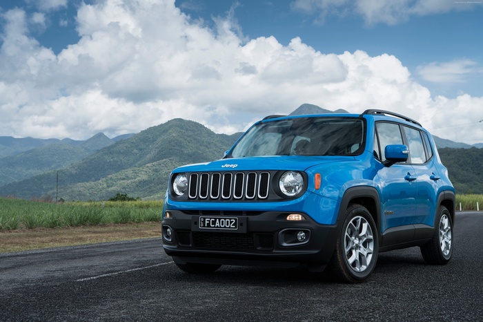 Blue Jeep Renegade Longitude SUV on a road