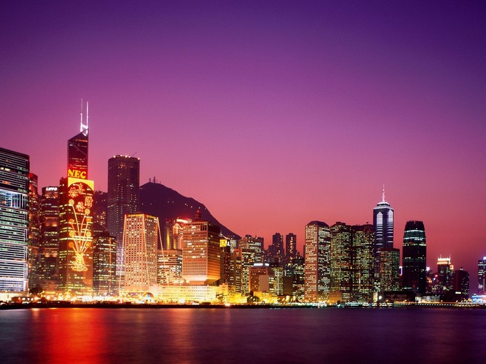 Hong Kong skyline at dusk with illuminated skyscrapers
