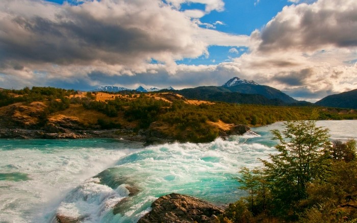 Patagonia Landscape with Mountains and River Rapids