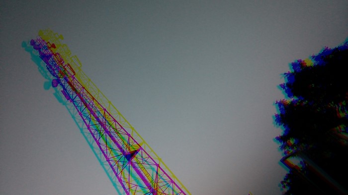 Cell tower with glitch art effect against sky