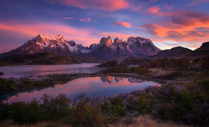 Torres del Paine mountains at sunset with lake reflection