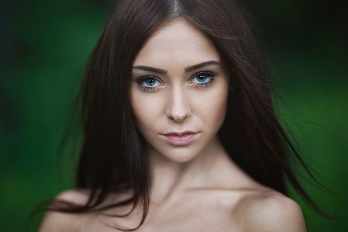Portrait of Woman with Long Dark Hair and Blue Eyes
