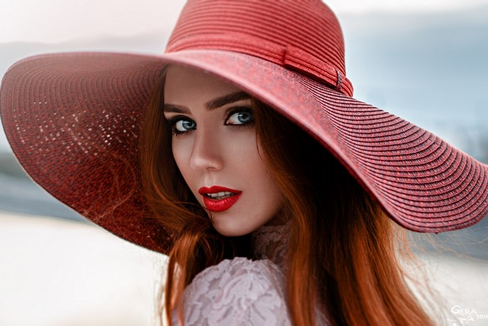 Portrait of Redhead Woman Wearing Wide Brim Hat