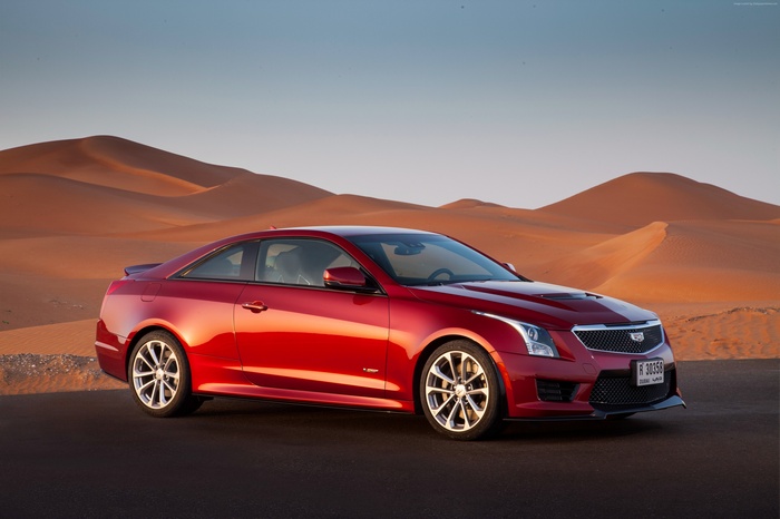 Red Cadillac ATS-V Coupe in Desert Landscape