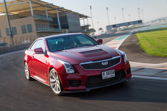 Red Cadillac ATS-V Coupe on a race track