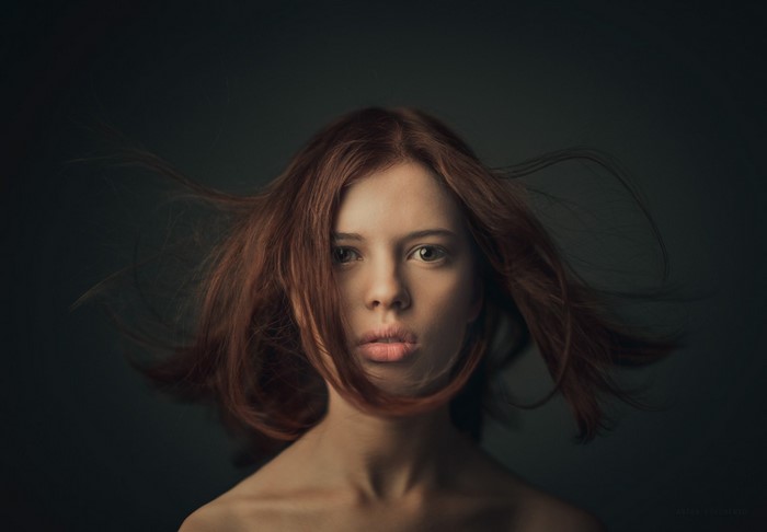 Portrait of a young woman with red hair