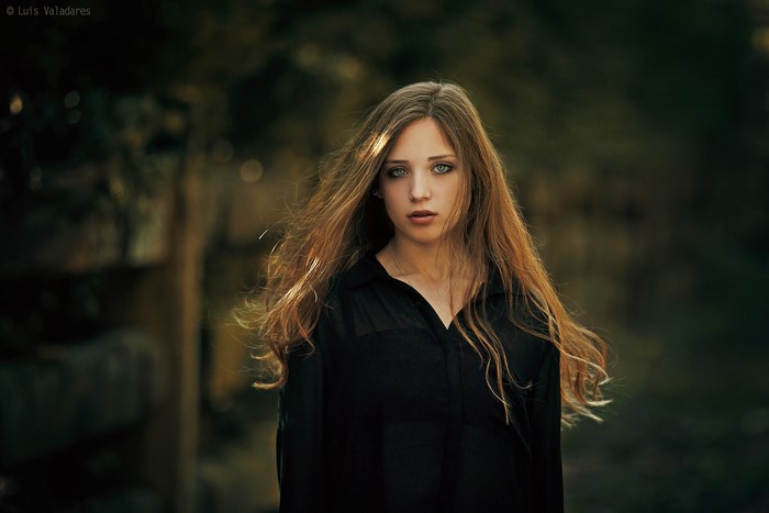 Woman with long blonde hair and blue eyes